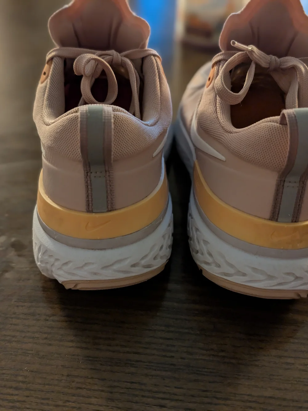 Nike Women’s React Running Shoes in Peach with Orange Highlights
